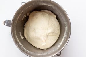 Pizza dough in a mixing bowl