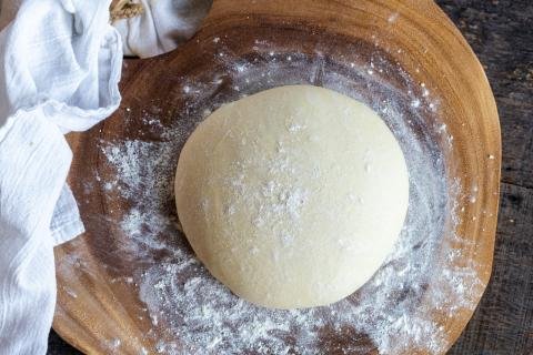 Pizza dough on a board