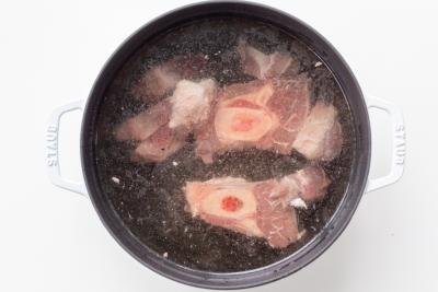 meat in a pot with borscht