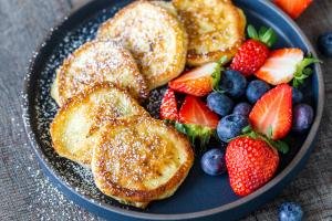 Cottage cheese pancakes on a plate with berries