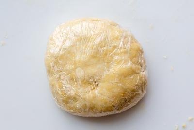 Pie crust dough rolled up in the plastic