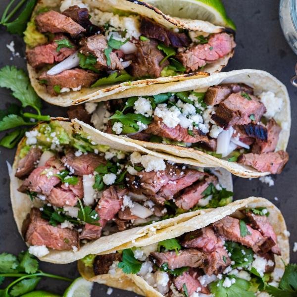 carne asada street tacos on a serving tray