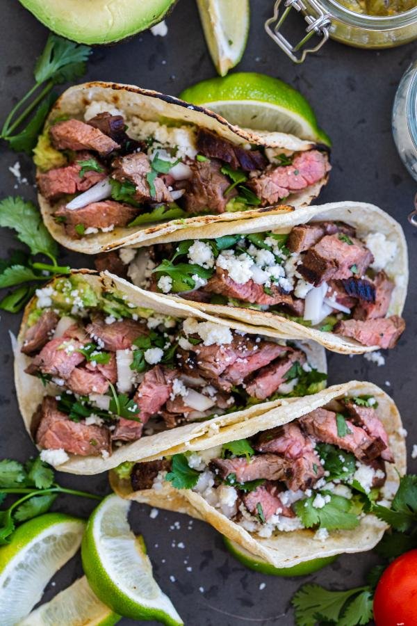 carne asada street tacos on a serving tray