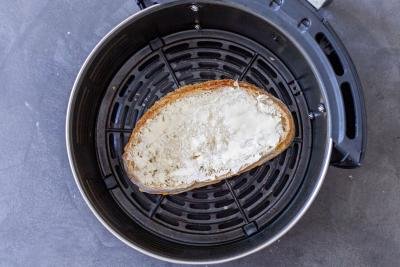 grilled cheese sandwich in a air fryer basket