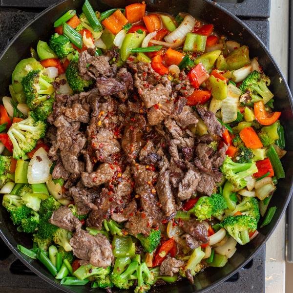 veggies, beef and sauce in the pan