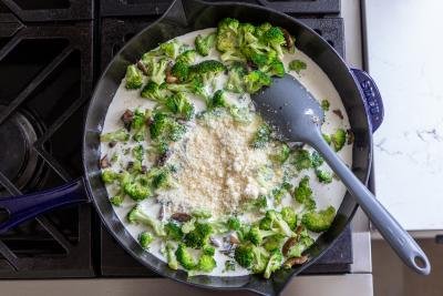 broccoli, cream and parmesan in a pan