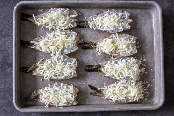 butterflied shrimp with cheese on top