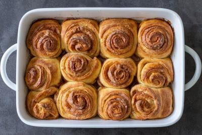 baked cinnamon rolls on a baking sheet