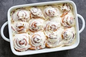 cinnamon rolls with cream cheese on top