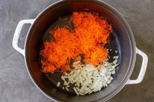 Pot with onion and carrots