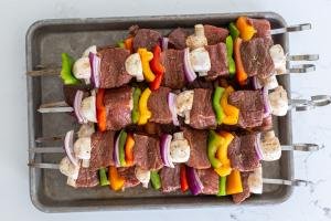 Shish Kabob with beef and veggies on a baking sheet