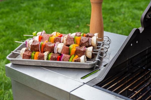 Shish Kabob with beef and veggies next to the grill
