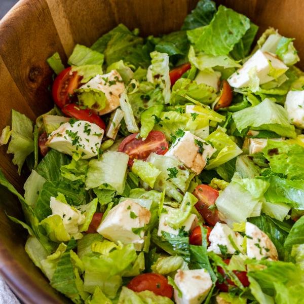 Salad in a wooden bowl