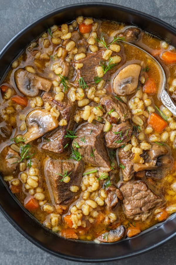 a bowl with beef and barley soup