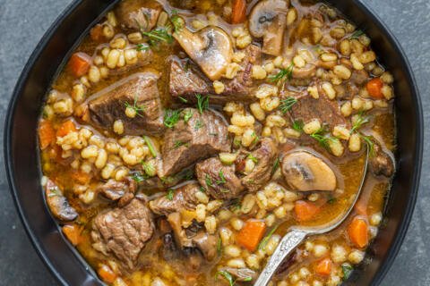 a bowl with beef and barley soup