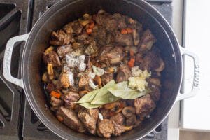 beef and seasoning in a dutch oven