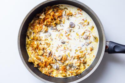 carrots and cream in a skillet