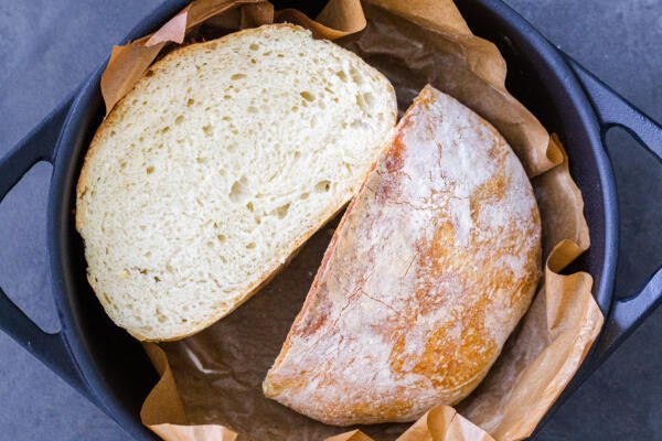 cut open No knead bread in a cast iron