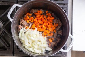 Pot with beef, carrots and onions