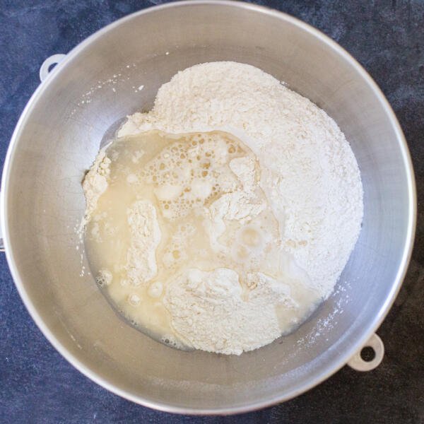 Dry ingredients and liquid for the pierogi in a mixing bowl