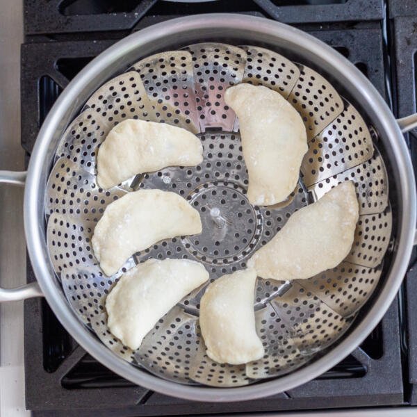 raw pierogi on a steamer