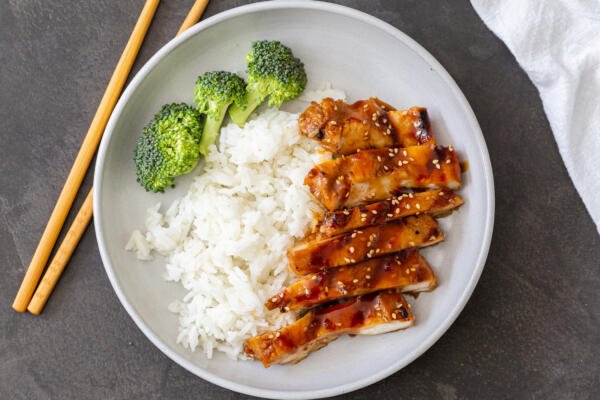 chicken with rice and broccoli on a plate