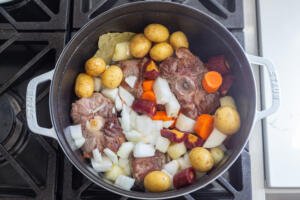 Oxtail and vegetables in a pot