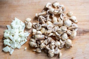 Mushroom and onions on a cutting board