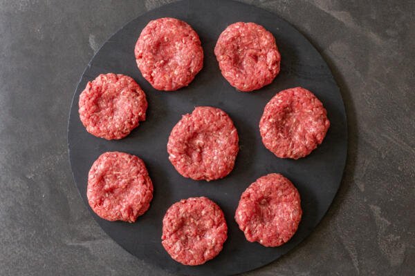 meat sliders patties on a tray