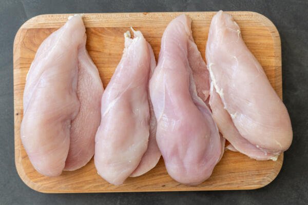 Butterflied chicken on a cutting board