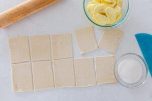 Puff pastry cut into pieces with sugar and apple slices