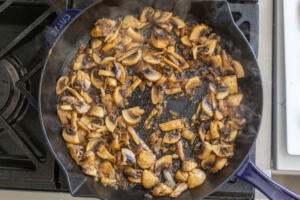 mushrooms browning in a pan