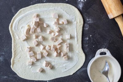 Pizza dough with ranch and chicken