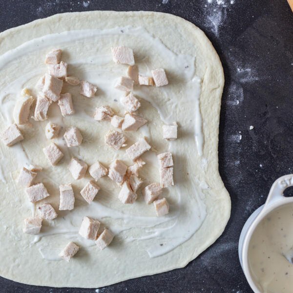 Pizza dough with ranch and chicken