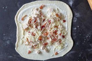 pizza dough with chicken cheese and bacon