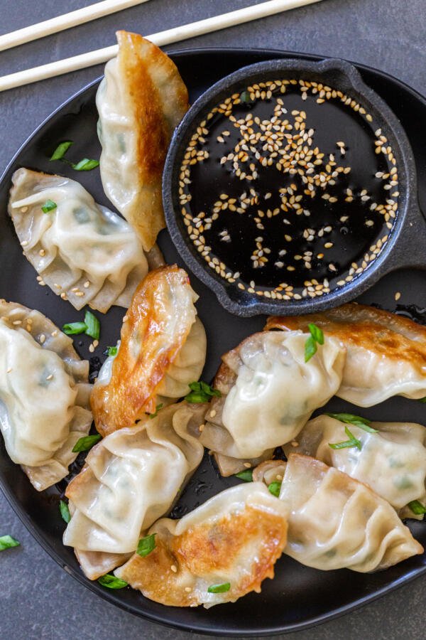 Gyoza on a plate with soy sauce