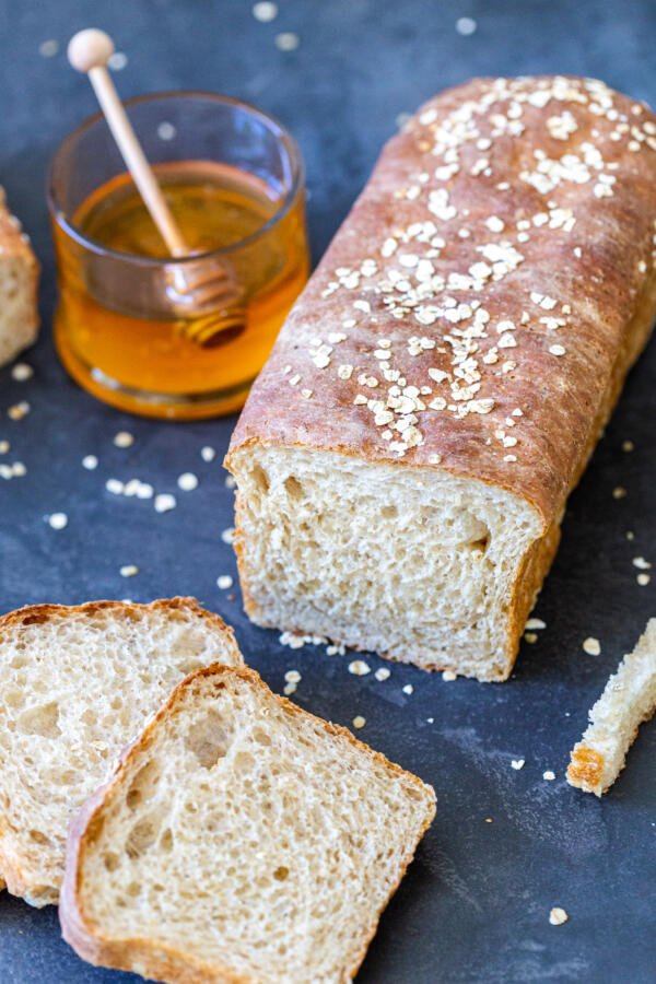 Honey Wheat Bread sliced open with a few slices next to it