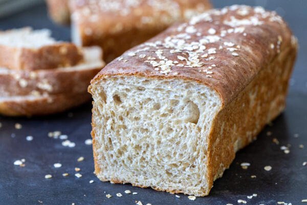 Honey wheat bread with slices on the side