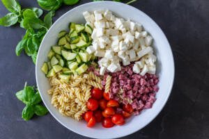 A bowl Italian pasta salad ingredients