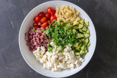 A bowl Italian pasta salad ingredients