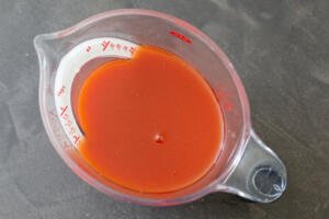 marinating sauce in a measuring cup