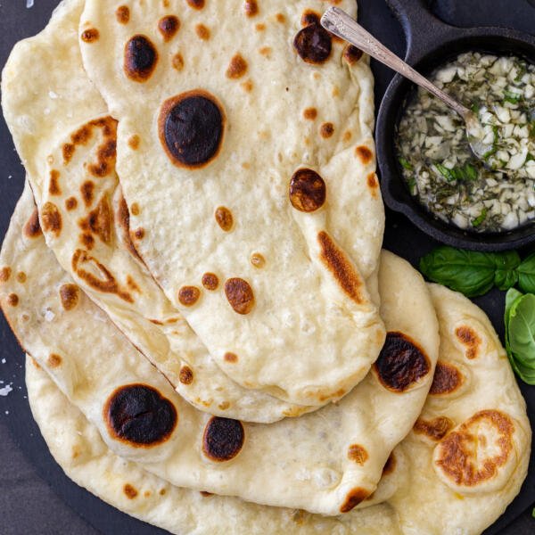 Naan Bread with garlic and herbs on a plate