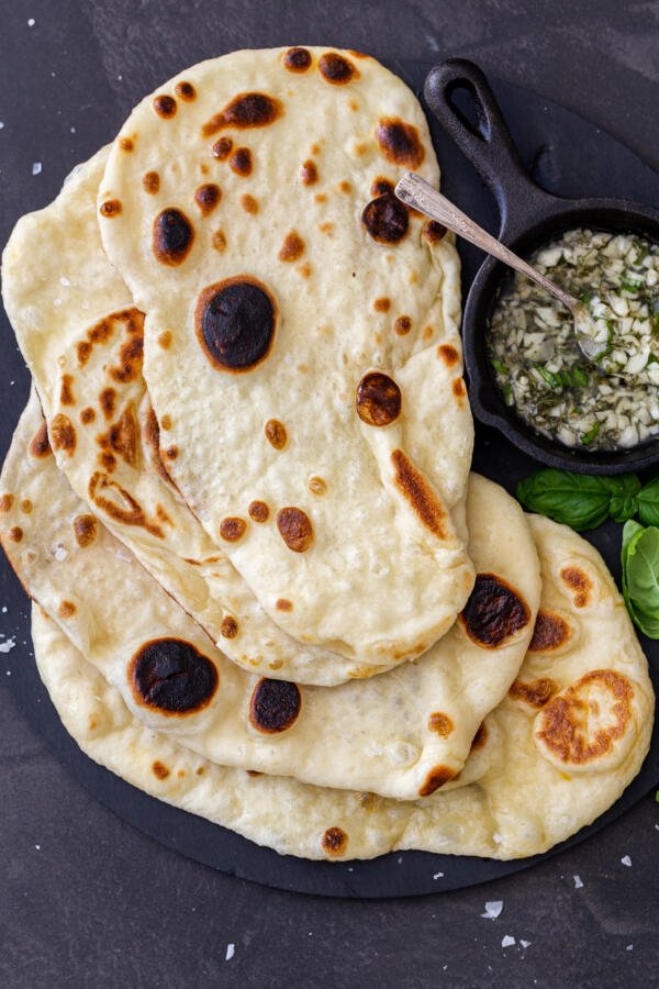 Naan Bread with garlic and herbs on a plate