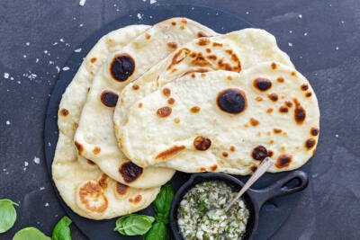 Naan Bread with garlic and herbs on a plate