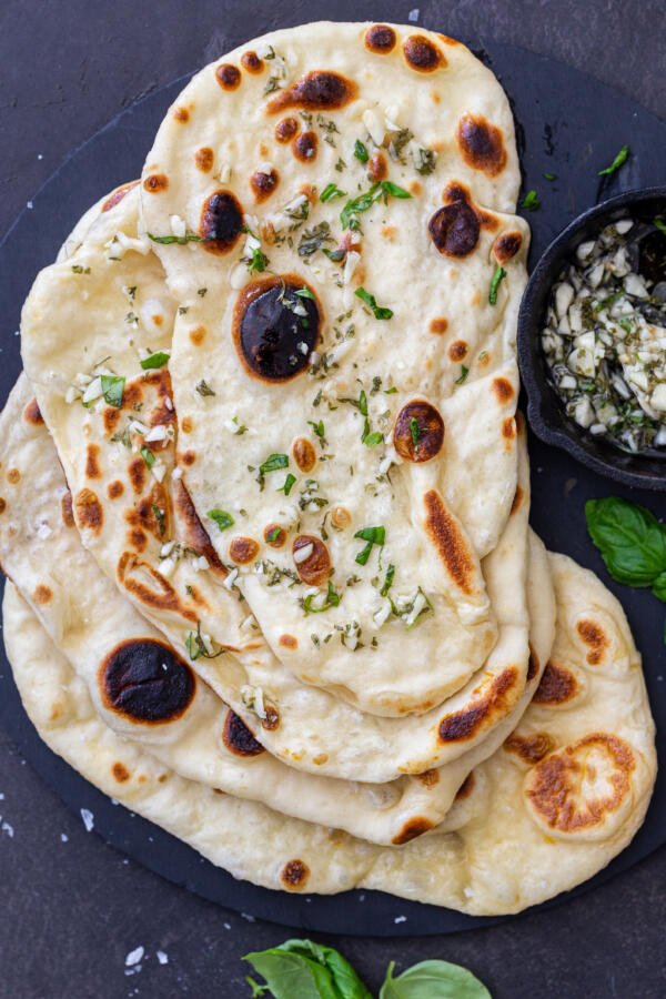 Naan Bread with garlic and herbs on a plate