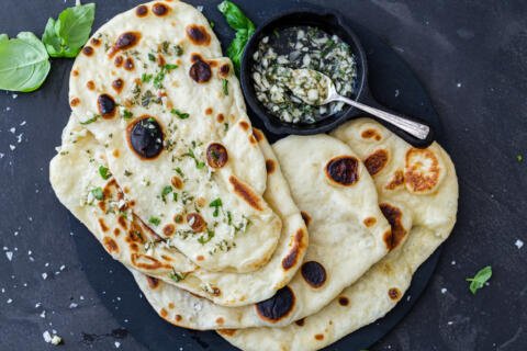 Naan Bread with garlic and herbs on a plate