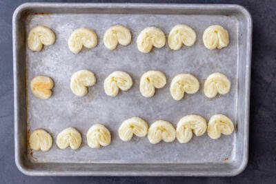 Palmier cookies on a baking sheet