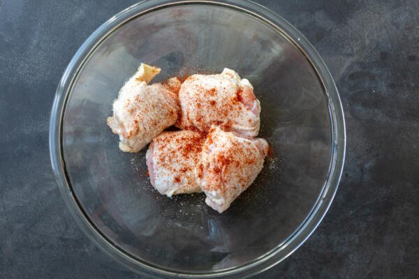 seasoned chicken thighs in a bowl