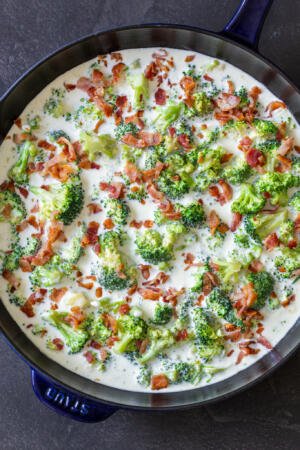 broccoli with bacon in alfredo in a pan