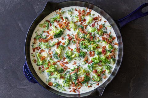 broccoli with bacon in alfredo in a pan